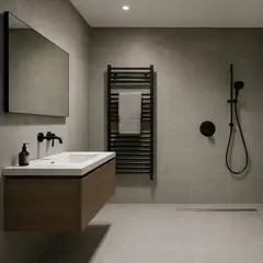 Contemporary bathroom with wall-mounted sink, black shower fittings, heated towel rail, and minimalist tile finish